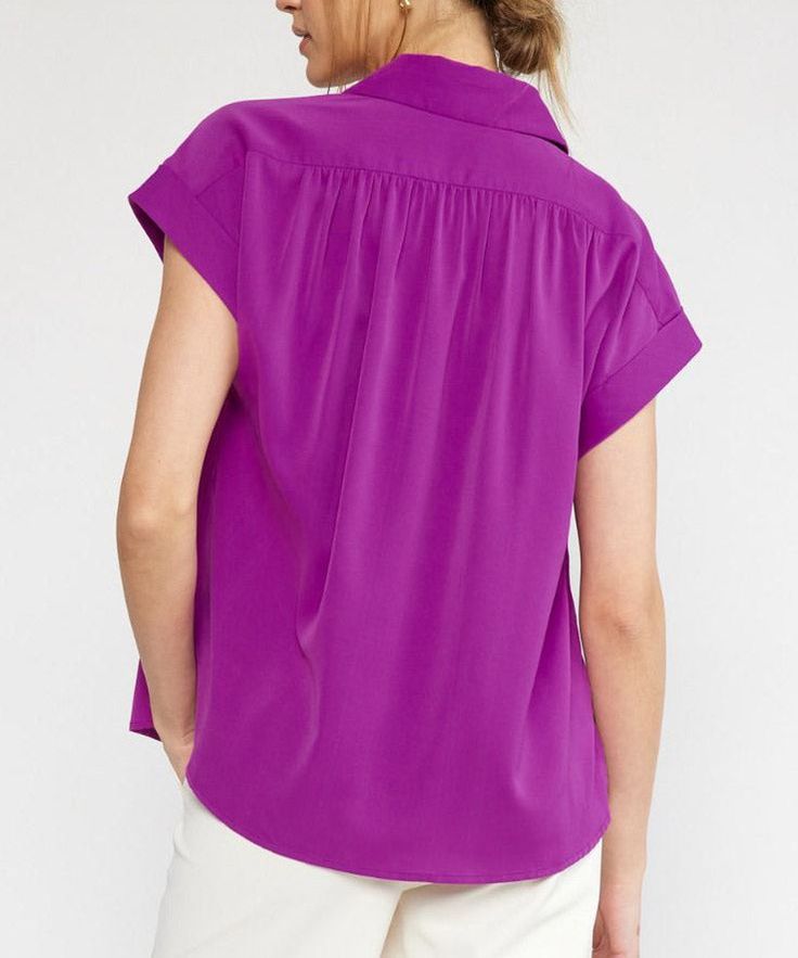 This lightweight top features a collared neckline, button down detail, short sleeves and permanent rolled cuffs. Easy to style for work or play, this top is versatile, comfortable and chic. 100% polyester Unlined, woven, non-sheer, lightweight Model is wearing a size small and is 5'10" Plum Top, Collared Top, Belted Midi Dress, Suede Skirt, Black Midi Skirt, Lightweight Tops, Collar Top, Striped Tank Top, Striped Tank