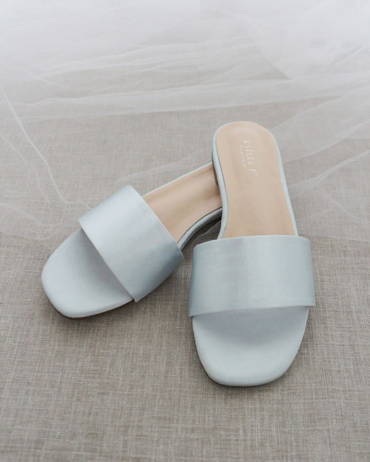 Classic slide flat sandals for casual and dressy look. Simple and easy wear for brides, bridesmaids and wedding parties.DETAILS:COLORS AVAILABLE: Ivory, Light Blue, White, Pink, and ChampagneUPPER: Synthetic upper and liningMATERIALS: Mandmade outsole STYLE NAME: EVELYN Summer Flat Heel Bridesmaid Wedding Shoes, Summer Wedding Shoes With Flat Heel For Bridesmaids, Chic Wedding Sandals For Summer, Flat Summer Wedding Shoes For Bridesmaids, Summer Bridesmaid Wedding Shoes With Flat Heel, Chic Summer Wedding Guest Shoes, Chic Sandals For Wedding Guest In Summer, Chic Summer Sandals For Wedding Guest, Summer Party Slides With Flat Heel