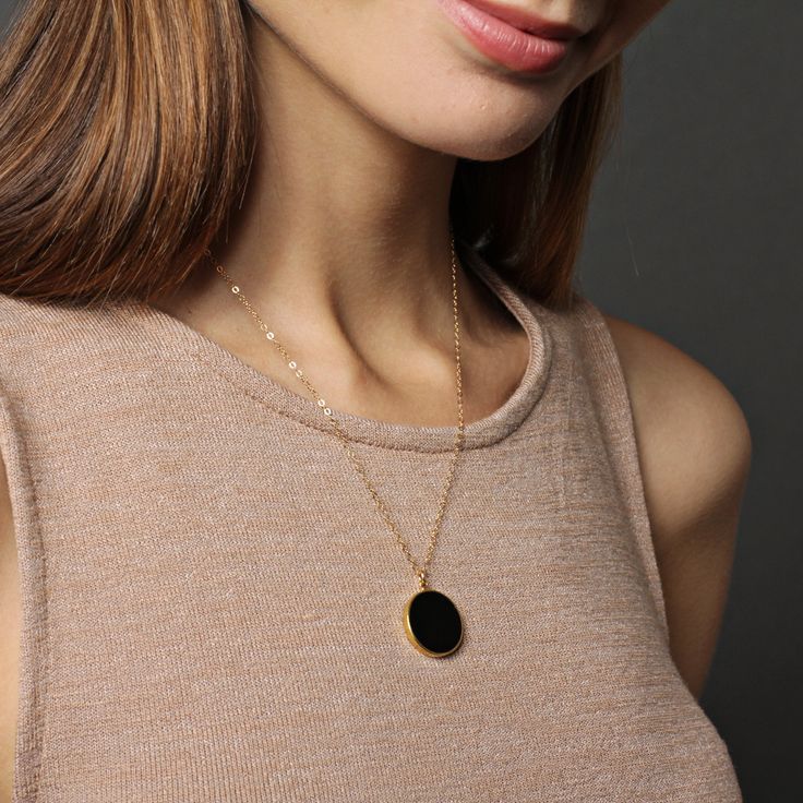 "Black onyx drop necklace on 14k dainty gold filled chain - Jewelry gifts for Her - Black and gold jewelry - Minimalist necklaces - Black Stone: Genuine black onyx Stone: 20mm diameter Gold chain: 14k gold filled Chain length: 18 inches Clasp: spring ring Arrives in gift box Made in the USA About \"Gold Filled Jewelry\": Also called rolled-gold. These jewelry items are not actually filled with gold. They are made of a base metal covered by sheets of gold in a mechanical bonding process. Effectiv Black And Gold Jewelry, Minimalist Necklaces, Gold Circle Necklace, Black Onyx Stone, Circle Necklace, Onyx Stone, Keep Jewelry, Minimalist Necklace, Drop Necklace