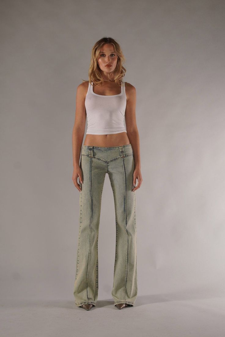 DESCRIPTIONInspired by your favorite early 2000s styles, this new low-rise is guaranteed to be the new must-have of 2024. The Kate Pant features a unique triangular design that hugs at the hips and accentuates your curves. These pants are made to contour all the right places and replicate that 2000s silhouette. The Kate is a relaxed, baby-flare that seamlessly blends at the knee and elongates your legs. Now in our Blue Obsession wash— a vintage-inspired 80’s light wash. DETAILSSuper Low-RiseBaby Flare Vintage WashPintuck Detail35” Inseam 20” Leg Opening Exposed Zipper 98% Cotton 2% Elastane MADE IN LOS ANGELES, USA Model is 5'7 & wearing a size 24 Early 2000s Style, Jean Crafts, Exposed Zipper, Jeans Size Chart, 2000s Fashion, Fit Inspo, Early 2000s, Jeans Brands, Premium Denim