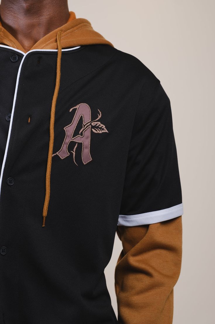 FINAL SALE We all want to be Authentic and you can literally wear what you mean with our Authentic Baseball Jersey. Part of the Baseball Jersey Collection. We added a A in the front right chest and a large bold "Authentic" Graphic in the back. Style: BTMH412S Black Fan Apparel Baseball Jersey, Black Top With Baseball Collar For Game Day, Black College Baseball Jersey Fan Apparel, Black Varsity Baseball Jersey For College, Black Baseball Jersey For Streetwear Fan Apparel, Black College Baseball Jersey, Black Tops For Baseball Game Day, Black Baseball Jersey With Graphic Print Fan Apparel, Black Cotton Baseball Jersey With Team Logo