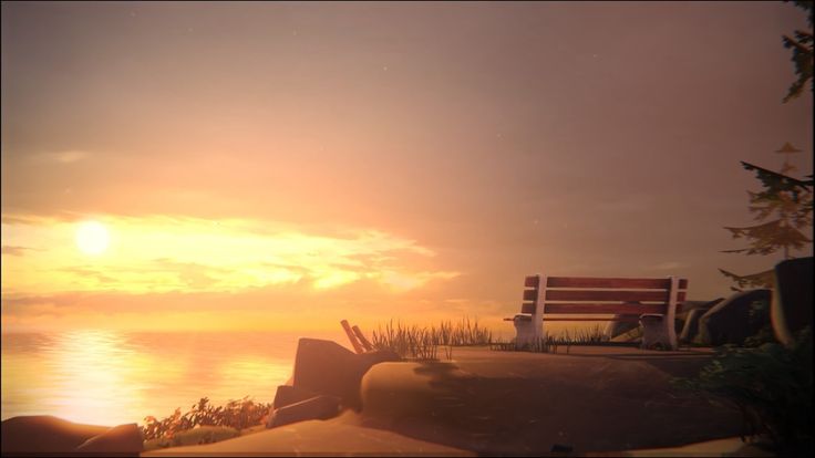 a bench sitting on top of a sandy beach next to the ocean under a cloudy sky