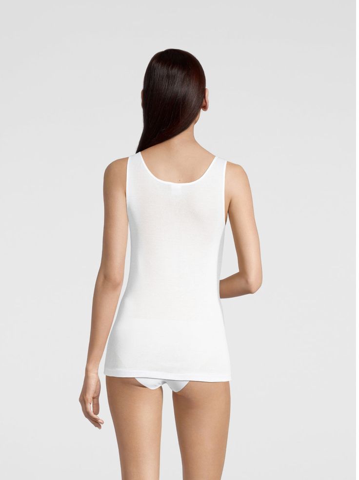 This tank top is meticulously crafted from the finest flat knit fabric using pure Egyptian Makò mercerized Cotton (Filoscozia®). It features an elegant V neckline and is designed without side seams, providing ultimate softness and comfort against your skin. The addition of sleek satin edging enhances its feminine appeal. This versatile top is perfect for layering under shirts or jackets, as well as a standalone piece for everyday wear. The cotton used is GOTS certified. Detailed Information: Sty Pants Gift, V Neck Tank Top, Primavera Estate, Your Skin, Knit Fabric, Layering, Sleeveless Dress, Everyday Wear, Knitwear