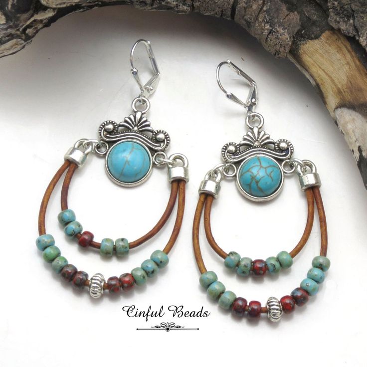 Add a touch of bohemian flair to your jewelry collection with these stunning boho dangle earrings. Featuring a unique southwestern connector, adorned with a vibrant turquoise resin cabochon, these earrings are an absolute must-have for any free-spirited fashionista. The intricate design further showcases delicate Picasso seed beads, carefully strung on two strands of supple leather cord. With their combination of colors and textures, these earrings will effortlessly elevate any boho-inspired ensemble. Complete your look with these statement earrings and embrace your inner wanderlust in style. All jewelry is packaged ready for gift giving as shown in the last photo. Each item comes in an organza bag with a care card and packaged in a kraft paper box. MORE LEATHER JEWELRY can be found here: Bohemian Brown Beaded Nickel-free Earrings, Bohemian Adjustable Teardrop Earrings, Bohemian Chandelier Earrings With Ear Wire For Festivals, Bohemian Teardrop Jewelry With Dangling Beads, Bohemian Brown Jewelry With Matching Earrings, Bohemian Ear Wire Jewelry For Beach, Bohemian Ear Wire Jewelry For The Beach, Nickel-free Brown Beaded Earrings For Festival, Bohemian Jewelry With Ear Wire For Beach