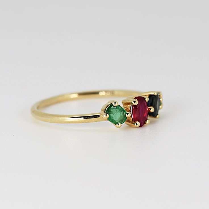 This beautiful cluster ring was made of 14k gold band, 14k gold prong settings. It's perfect as engagement ring or statement piece. DETAILS ABOUT THE RING, MATERIAL AND STONES * 14k 1.2 mm solid gold band and prongs. * 5x3.5 mm oval shape ruby * 4x3 mm oval sapphire * 4x3mm 0val emerald * 2.5mm round emerald * Birthstones : September, May, July We can make this design with any of gemstones. Please contact us. This ring was hand crafted in Melt'm Jewelry Studio in California. Thanks for visiting 14k Gold Cluster Ring With Birthstone, Cluster Birthstone Promise Ring With Center Stone, Yellow Gold Gemstone Cluster Promise Ring, 14k Gold Birthstone Cluster Ring, Formal Cluster Three Stone Rings, 14k Gold Cluster Ring With Prong Setting For Promise, Fine Jewelry Three Stone Cluster Rings, Timeless Multi-stone Diamond Promise Ring, Gold Cluster Birthstone Ring With Gemstone