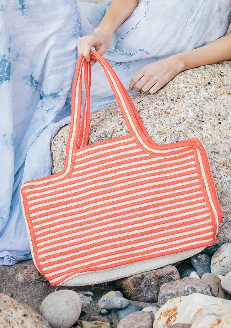 [Color: Pink/Natural] A handwoven striped cotton tote bag. With double strap handles and a wide carry all size. Casual Striped Rectangular Straw Bag, Casual Striped Rectangular Beach Bag, Striped Summer Style Bag, Casual Striped Woven Bag, Casual Striped Straw Bag For Beach, Striped Summer Beach Bag, Striped Shoulder Bag For The Beach, Casual Striped Beach Bag For Everyday Use, Spring Striped Beach Bags