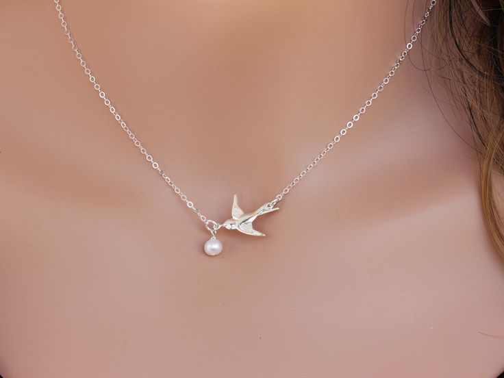 Dove Bird Necklace, Freshwater Pearl Necklace This necklace express for love and friendship All metal components onto High Quality Sterling Silver or 14k gold fill. This beautiful necklace consists of, -Sterling Silver Dove Pendent, -5mm Gem quality Freshwater Pearl and -Sterling Silver cable chain with end to end to Spring Claw. -Come up with beautiful ribbon gift box and -Care instruction pack . MORE BIRD https://www.etsy.com/shop/rainbowearring?ref=hdr_shop_menu&search_query=bird PET LOVE Elegant Bird Design Jewelry For Gift, Elegant Sterling Silver Necklace With Bird Design, Elegant Bird Design Jewelry Gift, Bird Pendant Necklace For Gift, Bird Design Pendant Necklace As A Gift, Bird Design Pendant Necklace For Gift, Bird Design Pendant Necklace As Gift, Bird Design Pendant Necklace Gift, Elegant Bird Design Jewelry For Anniversary