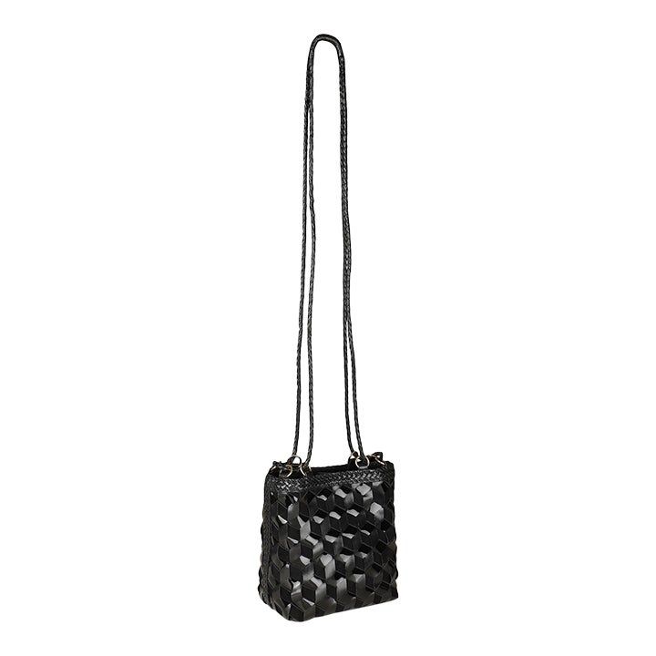 Crossbody bucket bag in black handwoven leather and suede mix. Fully lined with inside pocket and magnetic snap closure. Black Woven Leather Crossbody Bucket Bag, Black Top Handle Bucket Bag With Woven Leather, Black Woven Leather Top Handle Bucket Bag, Elegant Woven Leather Crossbody Bucket Bag, Black Woven Leather Clutch Bag, Chic Evening Bucket Bag With Leather Handles, Black Woven Leather Pouch Shoulder Bag, Evening Leather Bag With Braided Handles, Chic Crossbody Bucket Bag With Intrecciato Weave