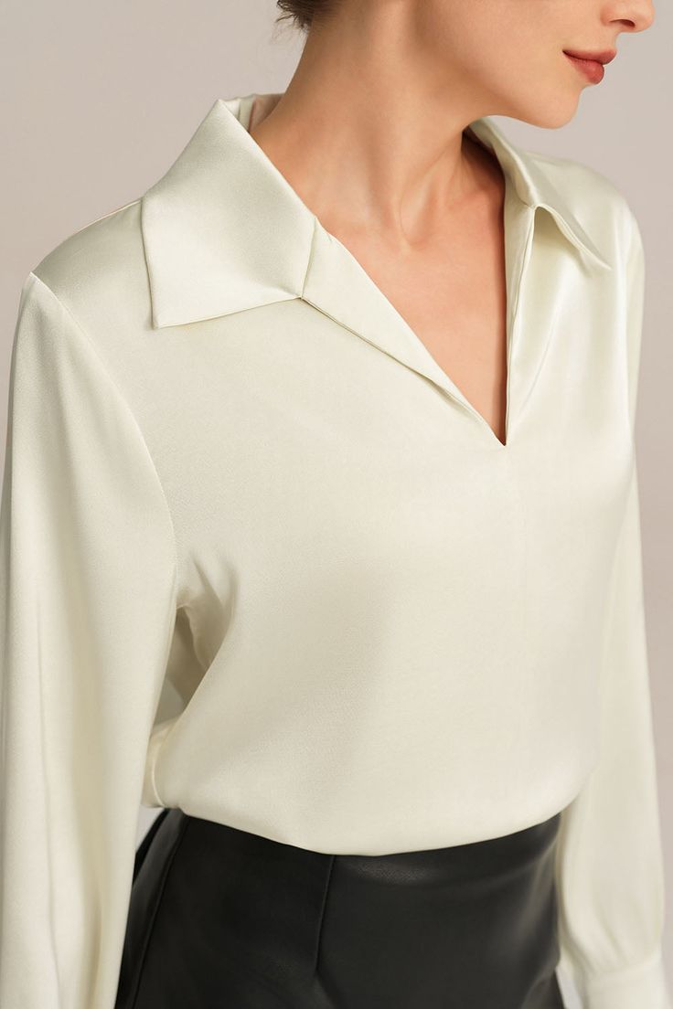 Experience the epitome of elegance with our Satin Blouse. Combining a loose fit with a smooth and comfortable fabric, this blouse is designed to make you feel effortlessly stylish. With long sleeves, a flattering V-neck, and a lapel collar, this piece exudes timeless charm. Material : 95%Polyester+5%Elastane.Elasticity : Low Stretchy.Sku : CL2156A23Package : 1*TopsCare instructions: Max wash temp: 30℃, No bleach, No tumble dry, Iron max 110℃, Wash dark colors separately, No PU ironing. Versatile Beige V-neck Blouse, Chic Solid Color V-neck Shirt, Elegant V-neck Blouse For Office, Formal V-neck Solid Color Tops, Versatile Solid Color Blouse For Office, Versatile Solid Color Office Blouse, Chic Solid Blouse For Work, Versatile V-neck Blouse For Office, Chic Solid Color Blouse For Work