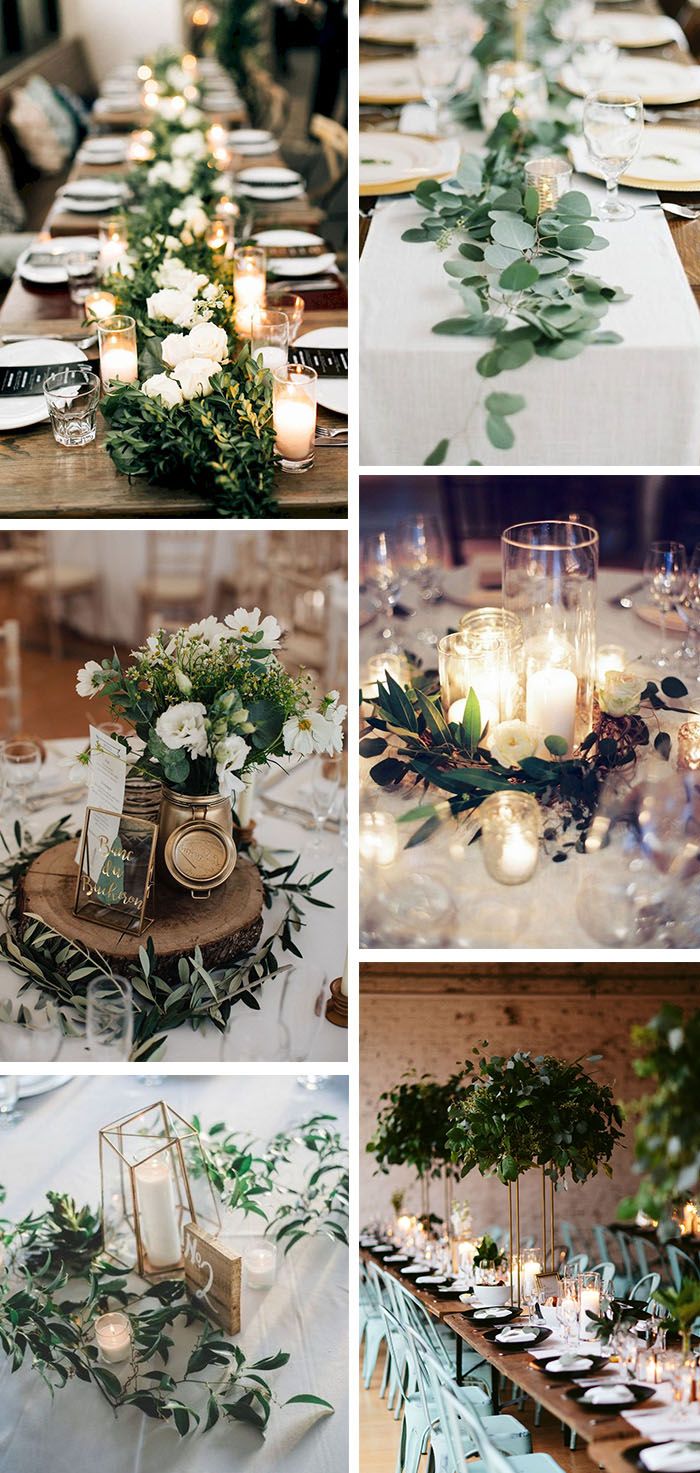 the table is set with candles and greenery