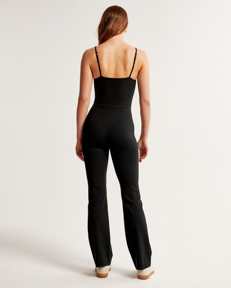 Elevate your wardrobe with the Abercrombie & Fitch Women's Ponte Unitard Flare Jumpsuit, a blend of elegance and comfort. This chic piece is designed to sculpt and highlight your silhouette, making it a perfect choice for both day and evening wear.

- Size: XXS
- Color: Black
- Material: Viscose, Nylon, Elastane
- Gender: Female
- Features: Square neckline, adjustable straps, slim flare pant leg

Crafted from our premium ponte fabric, this jumpsuit offers a flattering square neckline and adjusta Stretch Strapless Elastane Jumpsuit For Night Out, Stretch Elastane Strapless Jumpsuit For Night Out, Fitted Bodysuit With Adjustable Straps For Loungewear, Stretch Strapless Jumpsuit In Solid Color, Black Fitted Strapless Jumpsuit In Elastane, Black Strapless Fitted Jumpsuit, Black Fitted Strapless Elastane Jumpsuit, Black Fitted Strapless Jumpsuit, Slim Fit Elastane Bodysuit