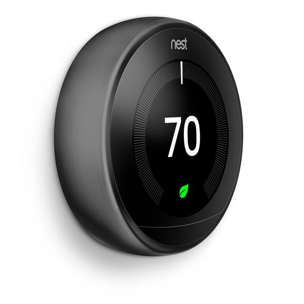 an nest thermostat on a white background