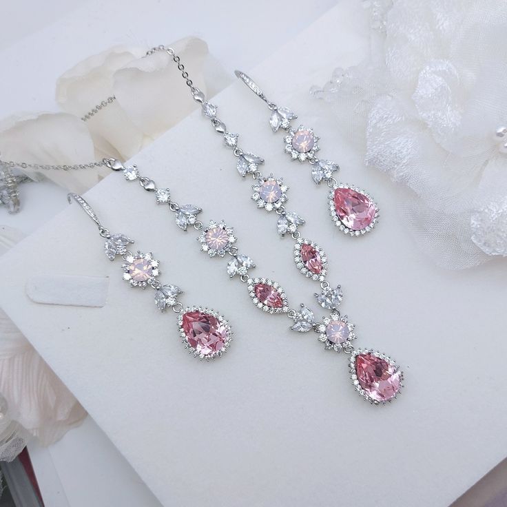 This listing is for a set of necklace and earrings.   Material: Swarovski pink opal crystal(not a real or simulated opal), Swarovski light rose crystal,  clear cubic zirconia, plated  brass settings.     Necklace length: 43cm, 46cm, 49cm, 52cm (Please leave message if you want different length).  Earrings size: full length 6.3cm. Teardrop at the bottom is 1.6cm.  Metal Color: Available in Rose Gold, Gold, and White Gold(silver tone). Please choose a color when you place the order.  Matching brac Silver Bridal Jewellery, Drop Chandelier, Ankle Bracelets Diy, Pink Statement Necklace, Desain Buklet, Rose Crystal, Gold Jewelry Simple Necklace, Bridal Jewelry Set, Rose Gold Bridal