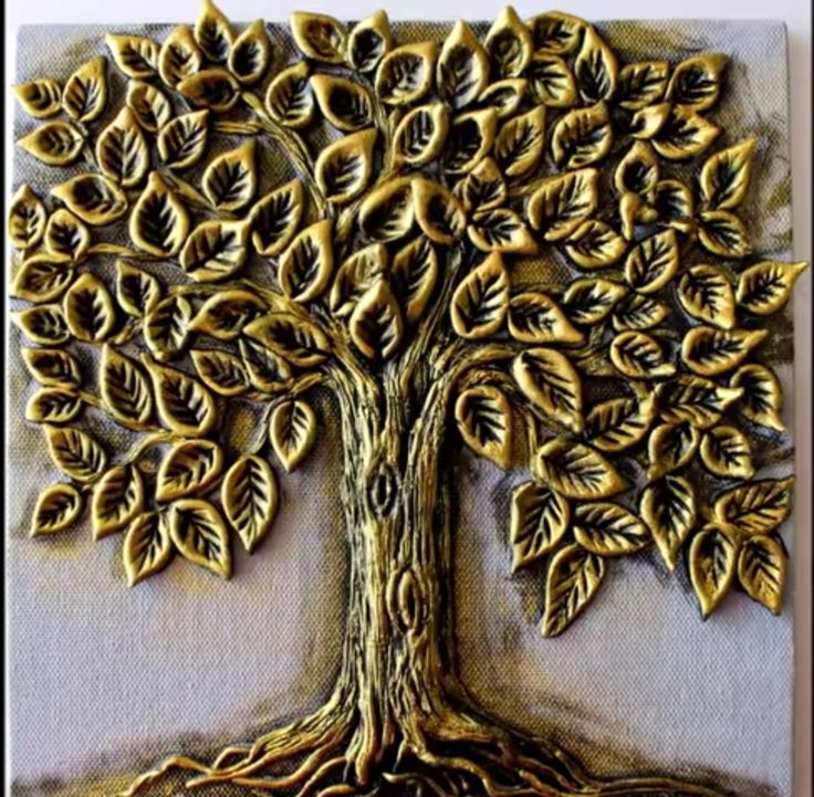 a gold tree with many leaves on it's trunk is shown in this painting