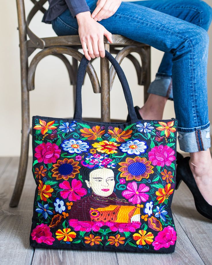 These beautifully Embroidered Tote Bags are not only a great statement piece, but a practical every day bag. Each bag is fully lined with an inside zippered pocket and padded shoulder straps. The bags measure 18" W x 14" H and comes in assorted colors and designs of Frida Khalo. Design is on the front side only. Email us at customerservice@luciasimports.com if you have any color preferences. Each purchase empowers Guatemalan artisans. 50th Clothing, Clothing Blogs, Stationary Gifts, Embroidered Tote Bag, Embroidered Tote, Wholesale Bags, Day Bag, Guatemala, Statement Pieces