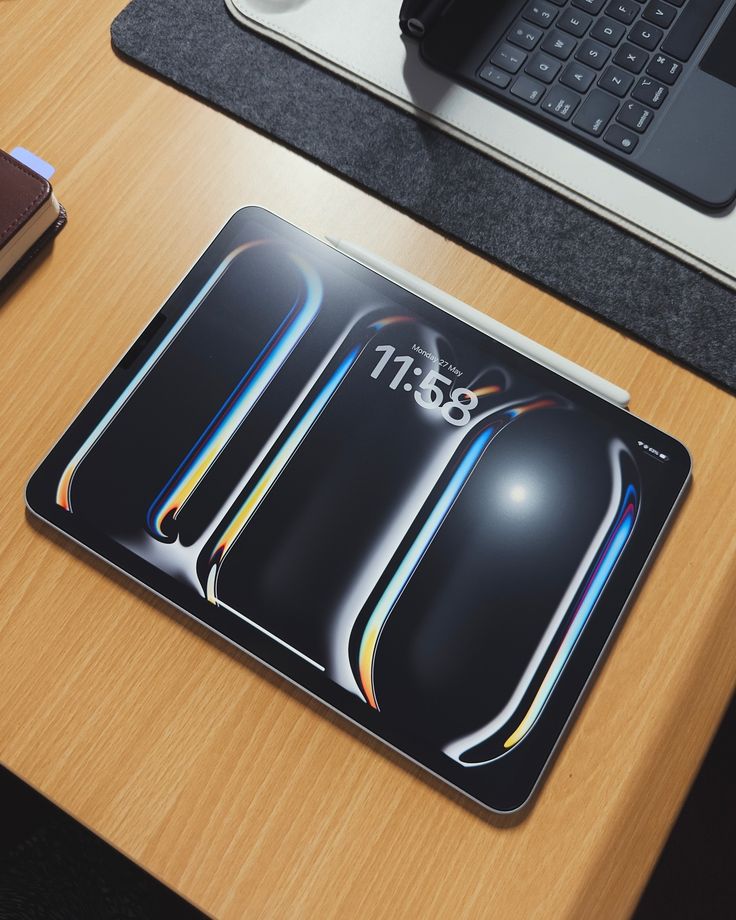 a mouse pad sitting on top of a wooden desk