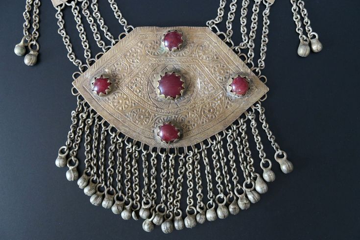 "This large traditional Lake Dal necklace was handcrafted during the early 1900's in the lush Kashmir Valley of Central Asia. It is very old tribal-jewelry, not a new reproduction. MEASUREMENTS (1 inch = 2.54 cm): Necklace Length = 32 inches Pendant = 5 inches long x 4.5 inches wide Weight = 7.4 oz Shipping Weight = 12 oz Image library 12-28-2022 Necklaces like this were traditionally worn in the region of Kashmir's romantic Dal Lake - especially at weddings. Prized by their owners, they were pa Traditional One-of-a-kind Necklace For Festival, Traditional One-of-a-kind Necklaces For Ceremonial Occasions, Traditional One Of A Kind Necklaces For Ceremonial Occasions, Traditional Ceremonial Necklaces, Traditional Pendant Necklace For Festivals, Bohemian Long Necklace For Ceremonial Occasions, Bohemian Long Necklace For Ceremonies, Artisan Necklace For Ceremonial Occasions, Ceremonial Engraved Necklaces