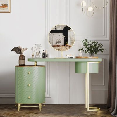 a green desk with a mirror on it