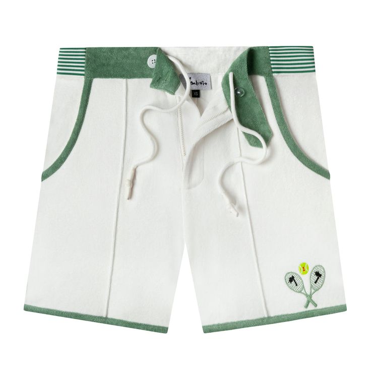 a pair of white shorts with green trims and embroidered flowers on the side,