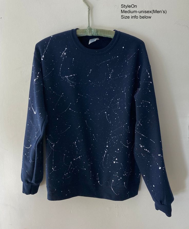 NEW Hand Painted white Shooting Stars (paint splattered) on a Navy blue Crewneck Sweatshirt. The original manufacture of the original blank sweatshirt is JERZEES NuBlend Fleece, 8oz., machine washable, and 50% cotton/50% Polyester. SIZE: ADULT(Men's) MEDIUM Crewneck Sweatshirt  According to  JERZEES NuBlend Adult MEDIUM is size with is approx. 22 inches, Body Length 27 1/2 - 28 inches and Sleeve Length from the center back is approx. is 35.5". PLEASE SEE STYLE ON'S OTHER ITEMS AT: http://www.ets Relaxed Fit Sweatshirt With Star Print For Fall, Relaxed Fit Star Print Sweatshirt For Fall, Winter Crew Neck Sweatshirt With Star Print, Winter Star Print Crew Neck Sweatshirt, Fall Star Print Crew Neck Sweatshirt, Painted Crewneck, Galaxy Sweater, White Streetwear, Acid Wash Shirt