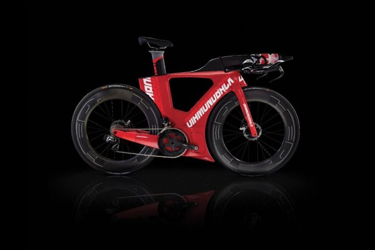 a red bicycle is shown against a black background