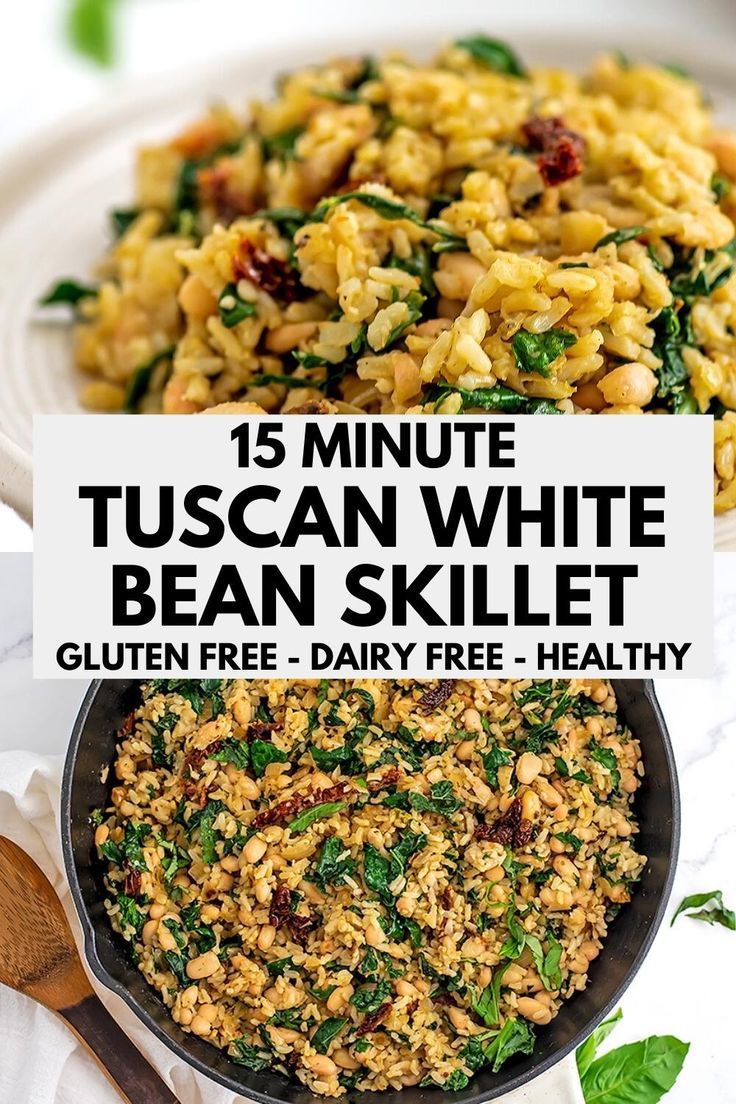 a white plate topped with pasta and spinach next to a skillet filled with beans