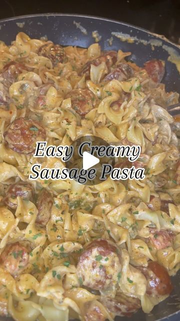 a pan filled with pasta and sausage covered in sauce next to the words easy creamy sausage pasta