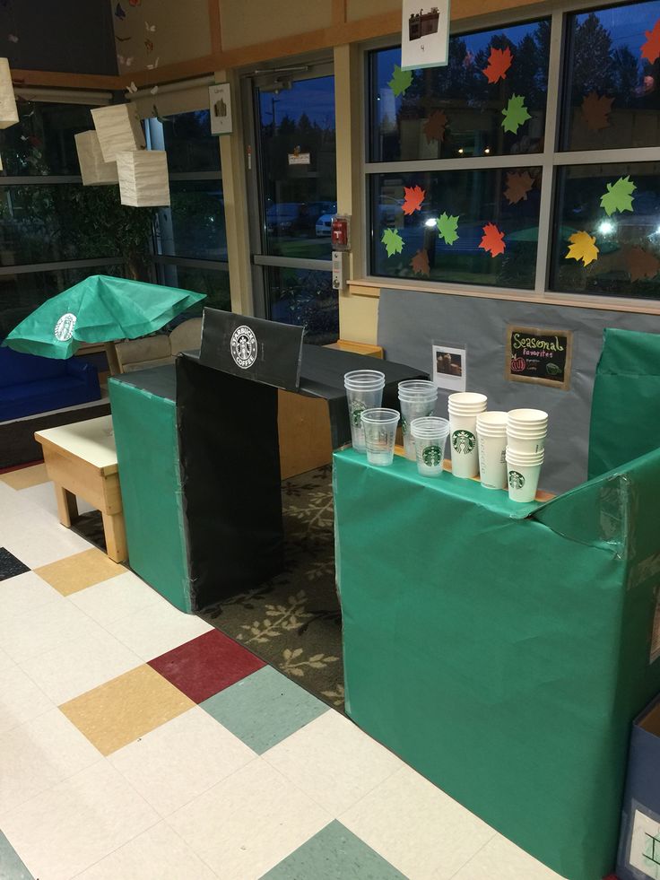 starbucks cups are on display in front of the window