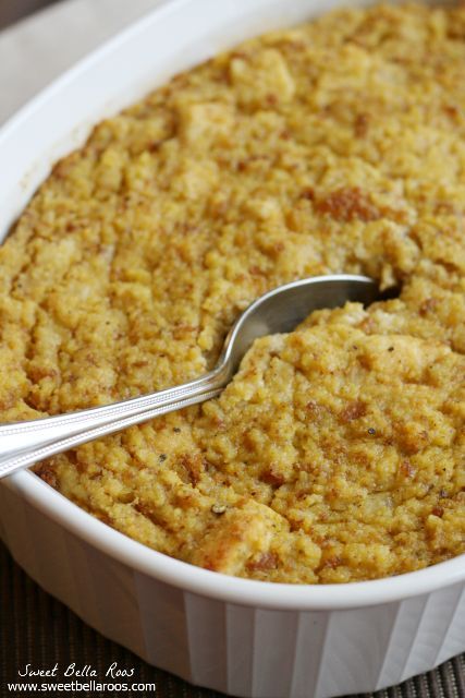 a close up of a spoon in a casserole dish with bread crumbs