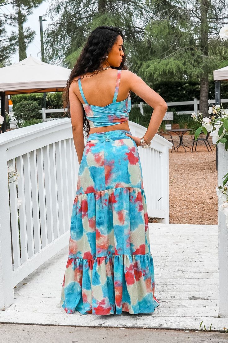 Get ready to turn heads and soak up the Miami vibes with this matching printed maxi skirt set. The cropped top and maxi skirt combo allows for versatile styling, while the vibrant print adds a touch of fun and playfulness to your outfit. Perfect for any summer occasion! Model is 5’4 wearing 3 1/2 inch heals: size small Fits true to size Spring Beach Two-piece Maxi Skirt, Two-piece Maxi Skirt For Beach Spring Season, Casual Summer Skirt Set, Summer Two-piece Maxi Skirt For Day Out, Summer Two-piece Tiered Skirt Dresses, Casual Multicolor Flowy Maxi Dress, Two-piece Maxi Skirt For Summer Day Out, Summer Two-piece Dresses With Tiered Skirt, Fitted Tiered Skirt Maxi Dress For Vacation