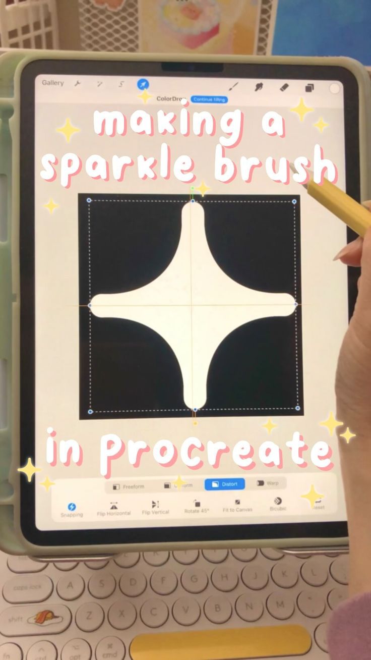 a person holding a pencil in front of a computer screen with the words making a sparkle brush in procreate