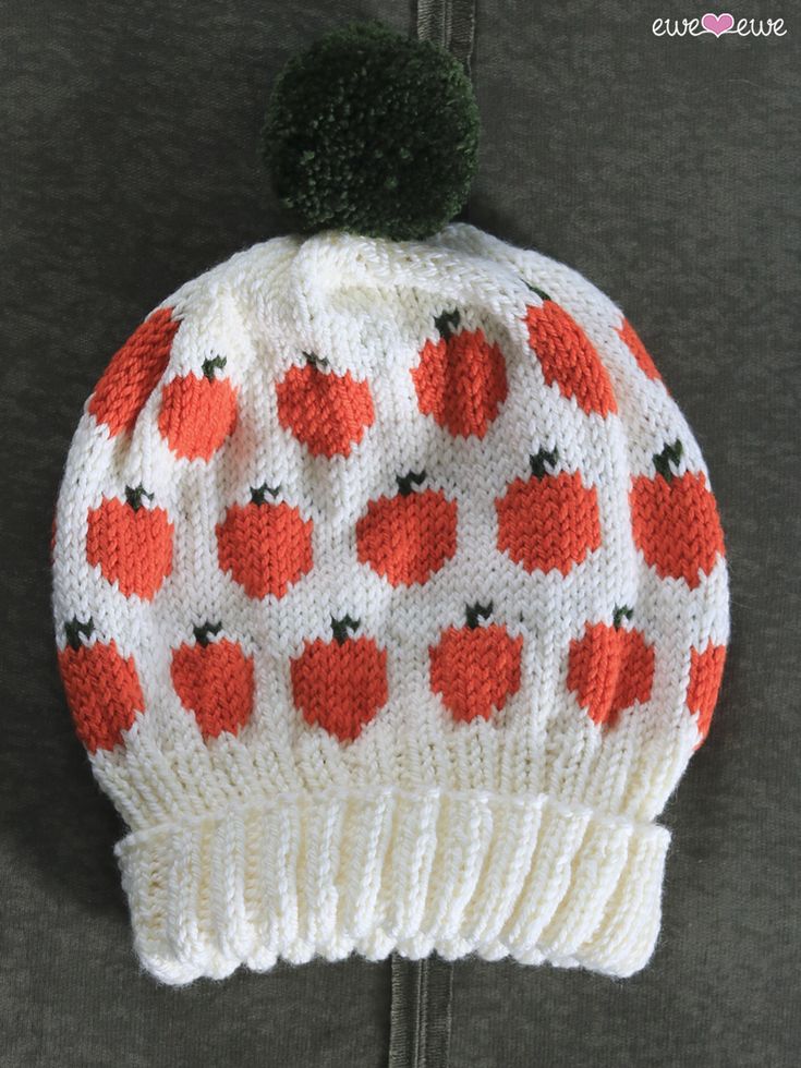 a knitted hat with apples on it