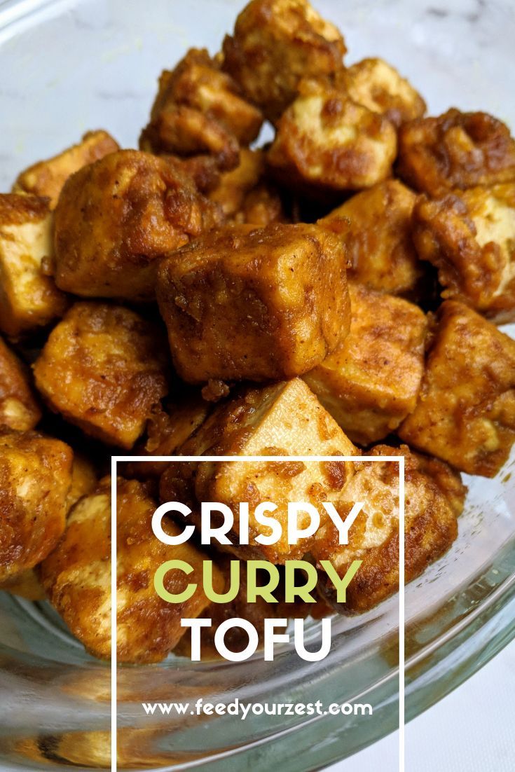 crispy curry tofu on a glass plate with text overlay that reads crispy curry tofu