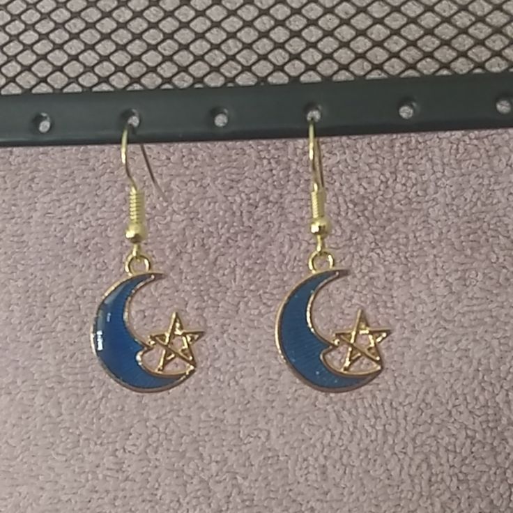 Blue Moon With A Gold Star On Nickel Free Gold Wires. New Without Tags Blue Moon-shaped Metal Jewelry, Blue Crescent Moon Charm Earrings, Blue Moon-shaped Earrings With Moon Charm, Blue Moon Shaped Earrings With Moon Charm, Blue Moon Charm Earrings, Blue Celestial Nickel-free Earrings, Blue Moon Shaped Celestial Earrings, Blue Crescent Earrings As A Gift, Blue Celestial Moon Earrings