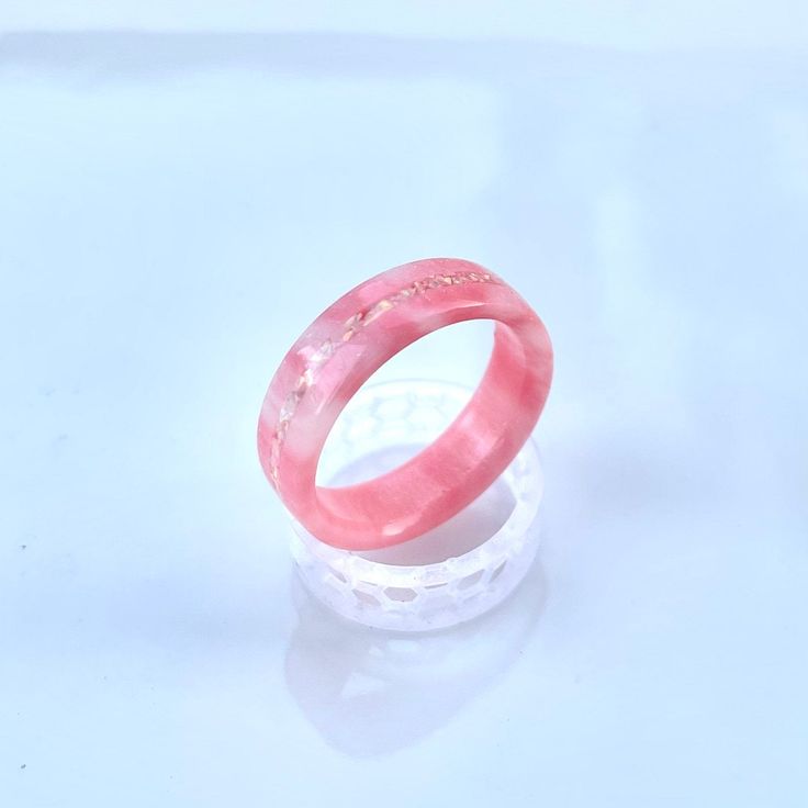 **Current processing time has been reduced to 6-8 weeks. Each ring is made to order in the order received. Thank you so much for your support and patience! 🎁 FREE Wood Ring Box with every ring purchase! 💎 Diamond Dust Ring made of real diamonds! Comes with a Certificate of Authenticity for the diamonds. Ring shown is 6mm wide with an Opal accent stripe. I will create rings at this width unless otherwise specified. If you are not purchasing a metal liner for the ring I can make from 2mm to 10mm Unique Clear Resin Ring, Unique Clear Resin Rings, Pink Open Ring Crystal Promise Ring, Pink Open Ring For Proposal, Pink Open Ring Jewelry For Proposal, Pink Diamond Ring Gift, Pink Open Diamond Ring Gift, Elegant Pink Flower Ring As A Gift, Adjustable Pink Flower Ring For Anniversary