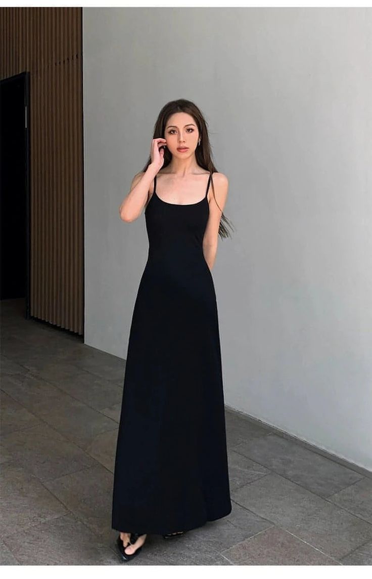 This elegant long dress features a figure-enhancing design that creates a slimming silhouette. The spaghetti straps add a delicate touch to this sophisticated piece. Perfect for those seeking to combine style and comfort this summer season. Ideal for any occasion, from casual outings to more formal events. Details Composition: 95% Cotton, 5% Spandex Design: Plain Style: Casual Thickness: Regular Occasion: Leisure Size & Fit Stretch: Some-stretch Fit Type: Shift Our model is 163 cm/5’3‘’ wearing Black Maxi Slip Dress With Adjustable Straps, Black Maxi Dress With Adjustable Straps, Elegant Black Sling Dress, Elegant Fitted Sling Maxi Dress, Elegant Sling Suspender Dress, Black Strappy Maxi Dress For Summer, Elegant Cami Maxi Dress For Summer, Black Slip Sundress With Adjustable Straps, Black Sundress With Spaghetti Straps