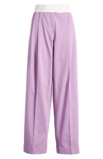 These cotton-gabardine pants in a gorgeous lilac hue feature tailored pleats and tapered legs that end at cuffed hems. 31" inseam; 16" leg opening; 13" front rise; 15 1/2" back rise (size 36) Zip fly with hook-and-bar closure Side-seam pockets 100% cotton Dry clean Made in Turkey Purple Wide Leg Work Pants, Purple Wide Leg Workwear Pants, Wide Leg Purple Workwear Pants, Purple Wide-leg Workwear Pants, Purple Wide-leg Pants For Work, Chic Pleated Purple Bottoms, Purple Tapered Leg Bottoms For Spring, Chic Purple Pleated Bottoms, Elegant Purple Bottoms For Workwear