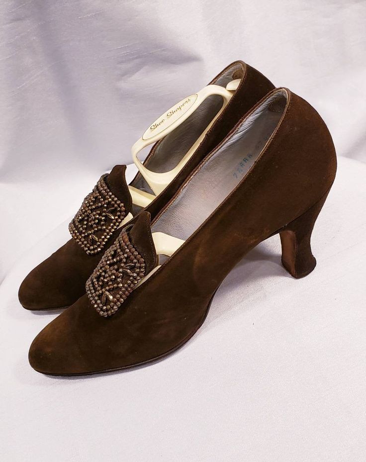 These solid 1900's ~ 1920's suede shoes are amazing! Attached to this pair of shoes is a steel cut buckle. Beautiful chocolate brown suede shoes are very wearable. Shoes are a size 7 1/2 aaa Measurements Length is 9 1/4 inches, width is 2 1/2 inches and heel is 2 1/2 inches. Incredible gently worn condition. Insole reads: Made for Sommer & Kaufman San Francisco Buyer to pay all related shipping charges. Questions Welcomed and Reasonable Offers considered Thank You Cityvintage Fitted Brown Vintage Heels, Vintage Brown Evening Heels, Vintage Evening Heels For Fall, Vintage Suede Low Heel Heels, Vintage Suede Heels With Low Heel, Vintage Closed Toe Heels For Fall, Vintage Suede Heels With Pointed Toe, Vintage Suede Heels With Almond Toe, Vintage Suede Pointed Toe Heels