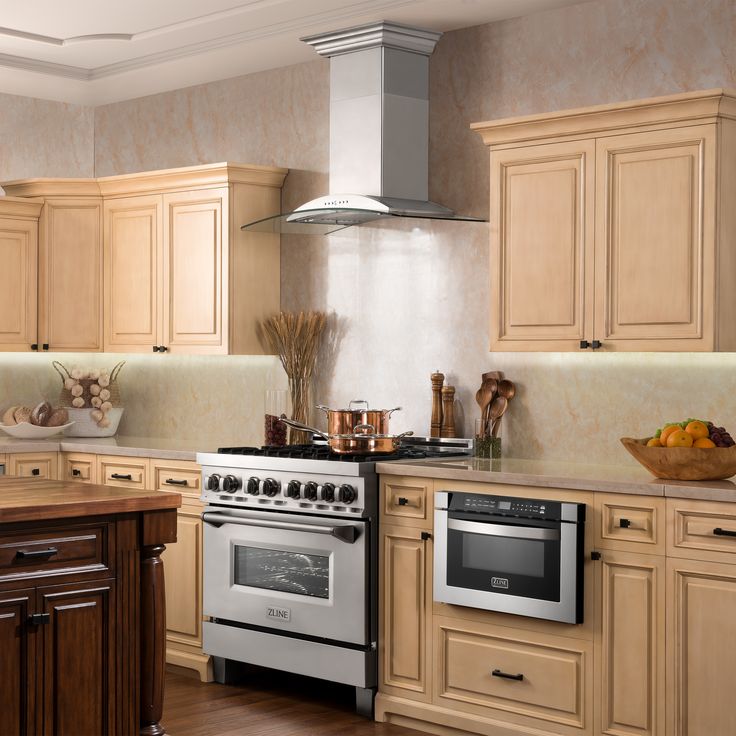 a kitchen with an oven, stove and counter tops in beige wood grain finish cabinets