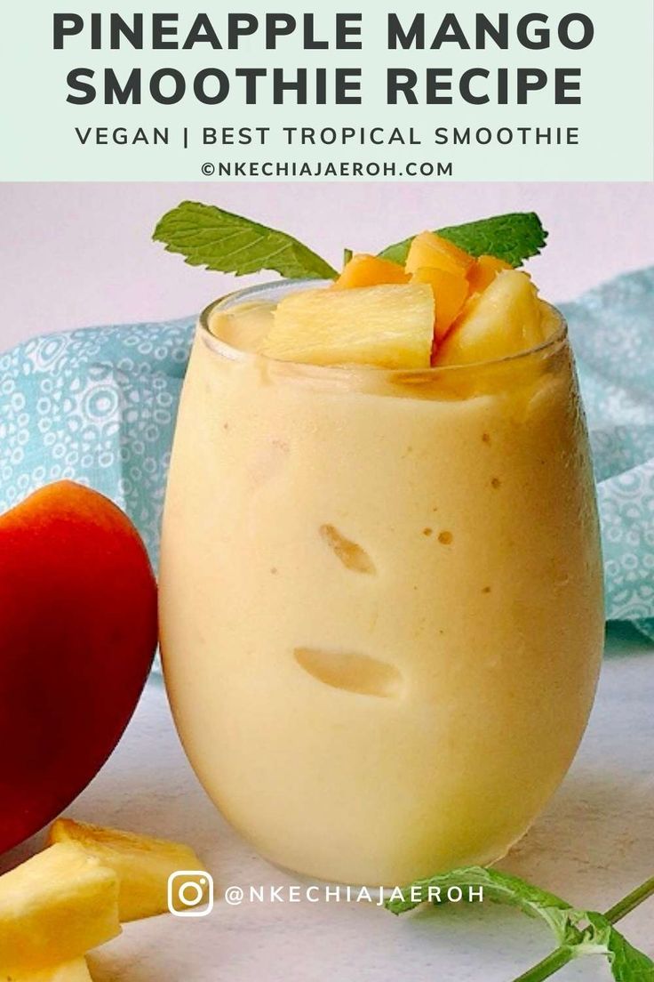 a smoothie in a glass with pineapple mango smoothie recipe on the side