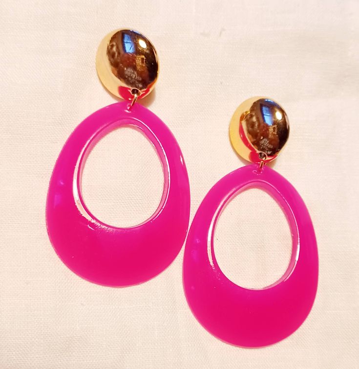 These are unique Handmade Pink acrylic hoops They hang 3 inches These are very lightweight on the ear Sturdy clip on closure They are one of a kind Handmade Pink Plastic Earrings, Pink Fun Hoop Earrings, Fun Pink Hoop Earrings, Pink Plastic Drop Earrings, Pink Beaded Hoop Earrings For Party, Pink Plastic Earrings For Party, Trendy Clip-on Hoop Earrings, Trendy Pink Plastic Earrings, Trendy Pink Beaded Hoop Earrings