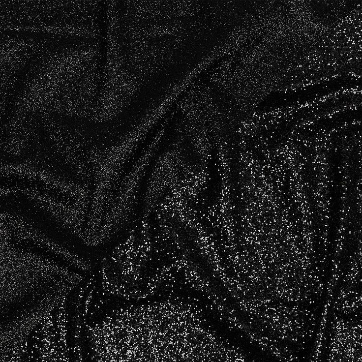 There is nothing more timeless than this Gala Black Double Faced Glitter Tulle. A black tulle base is adorned with black glitter on both sides, with one side showing a finer glitter than the other. The crisp hand and weighted drape make it an excellent choice for evening gowns, skirts, ball gowns, and bold capes, or use it for special occasion dresses, such as for weddings or quinceañeras. Opaque, a lining can be used for comfort if desired. Black Glamorous Sequin Fabric For Formal Events, Black Glamorous Sequin Fabric For Formal Occasions, Glamorous Black Sequin Fabric For Formal Occasions, Glamorous Black Sequin Fabric With Glitter, Elegant Black Sequin Fabric With Contrast Sequin, Glamorous Black Glitter Sequin Fabric, Black Glamorous Sequin Fabric With Contrast Sequin, Black Sparkling Sequin Fabric For Party Season, Sparkling Black Sequin Fabric For Party Season