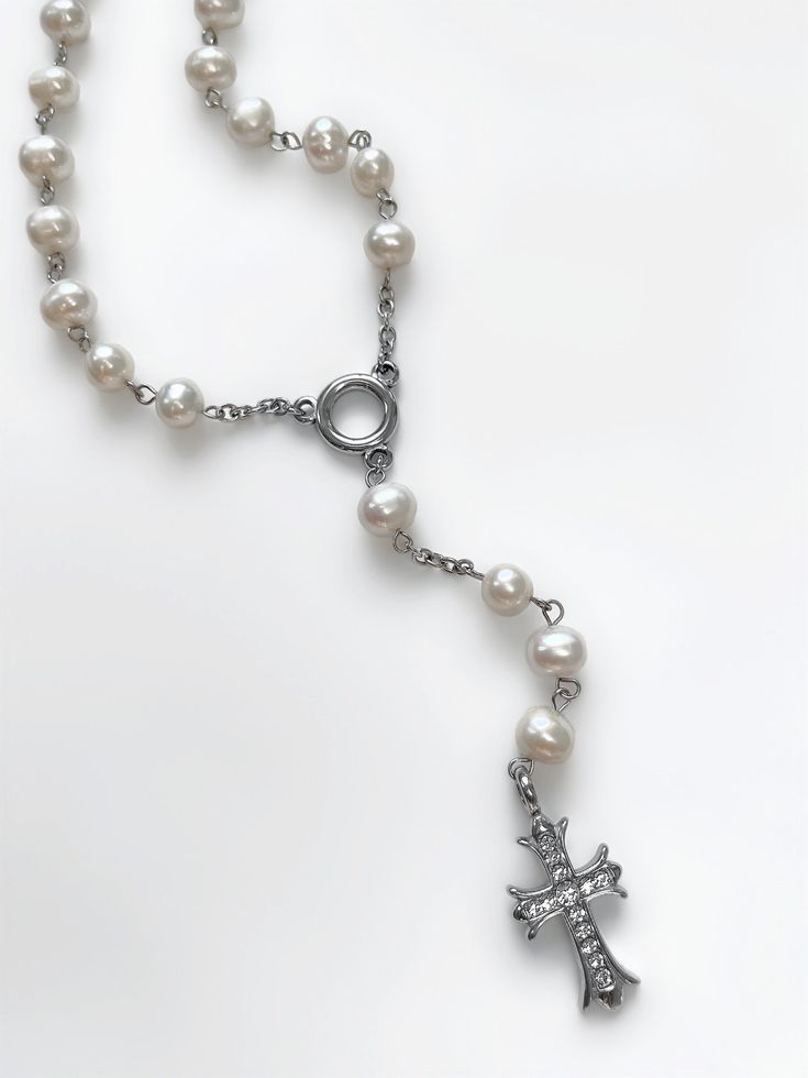 Devotion as clear as diamonds. Featuring a stunning CZ-encrusted cross pendant hand-strung alongside freshwater pearl rosary chain, the 'DEVOTION' embodies a dreamy, vintage-inspired look while being transcendently modern. Trust us, this necklace is guaranteed to become a treasured staple in your jewelry collection. Made with genuine AAA-grade freshwater pearls, CZ diamond encrusted cross pendant, and stainless steel chain. Waterproof & rust-free. Available in lengths 18", 20", 22", 24" with a 4 Sunday Core, Jewelry Cross Necklace, Cross Rosary, Best Online Clothing Stores, Cross Jewelry Necklace, Pearl Rosary, Folk Design, Catholic Jewelry, Rosary Necklace