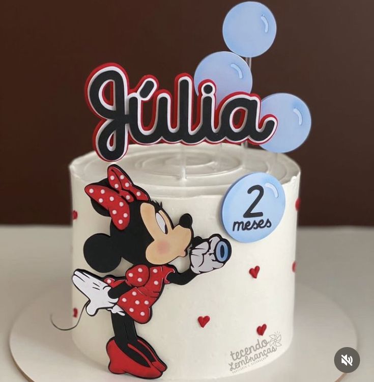 a mickey mouse cake with the name julia on it