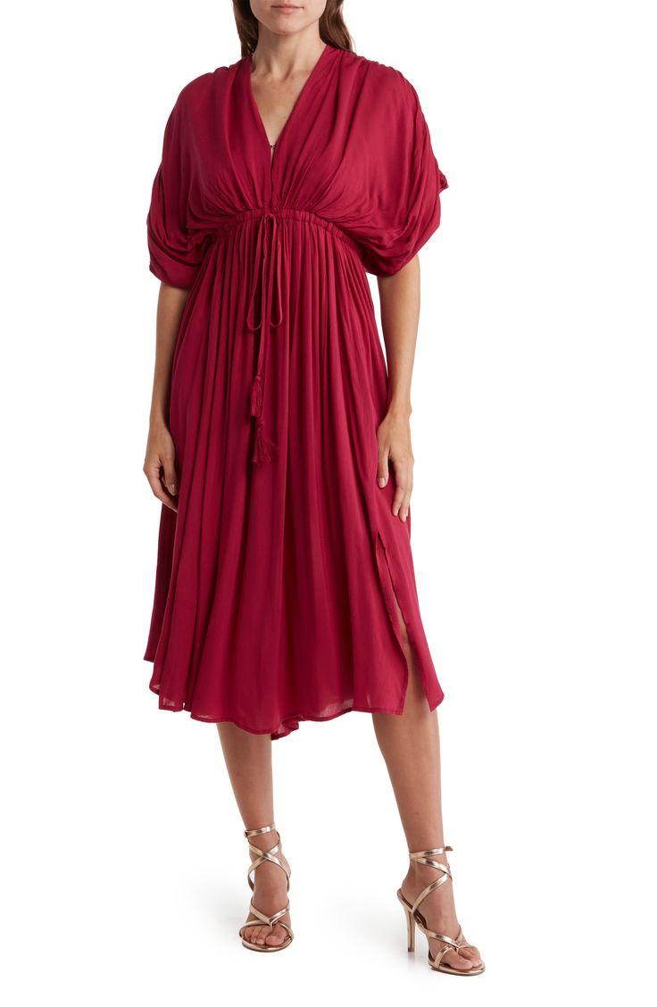 Slip into style with this puffed sleeve midi dress that exudes effortless attitude. 45" length (size S) V-neck Short puff sleeves Tied waistline 100% rayon Hand wash Imported Model stats: 5'10" height, 32" bust, 25" waist, 36" hip. Model is wearing size S. Spring Midi Dress With Pleated Flutter Sleeves, Summer Midi Dress With Flutter Pleated Sleeves, Summer Midi Dress With Pleated Flutter Sleeves, Viscose Midi Dress With Gathered Sleeves, Summer Viscose Dress With Gathered Sleeves, Flowy V-neck Puff Sleeve Dress For Brunch, Chic Midi Dress With Blouson Sleeves For Daywear, Summer Midi Dress With Blouson Sleeves For Daywear, Casual Midi Dress With Pleated Puff Sleeves