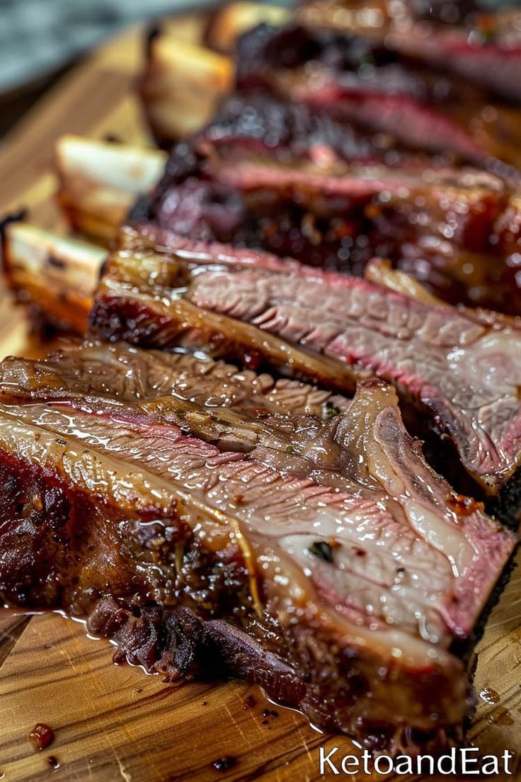 sliced up steak and onions on a cutting board