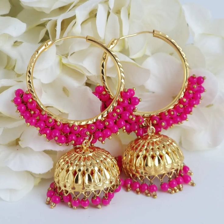 Elegant lightweight beaded Pearls Gold Plated Earrings to wear with your beautiful outfit and shine like a star. Choose from colors: Hot Pink, Coral, Baby Pink and Green. Dimension: L11cmx5cm Wieght: 13g each All our Jewelry pieces are delicately hand-made by artisan and can be different from pictures in color and details. Available in four colors. Please take extra care in use and storage. Temple Jewelry Beaded Earrings For Parties, Party Temple Jewelry Earrings With Dangling Beads, Festive Dangle Jhumkas With Tilla, Dangle Jhumkas For Diwali Festivities, Festive Dangle Jhumkas For Diwali, Danglers For Diwali Celebration, Diwali Celebration Danglers, Temple Jewelry Chandbali Beaded Earrings, Latkan Round Bead Earrings For Weddings