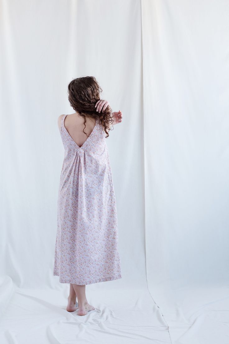 Floral cotton sundress. - Handmade from 100% organic cotton - Loose fit for extra comfort - V - neckline - Neat pleating on the front and back - Side pockets - Available in XXS-XXL - Cut and sewn to order in our studio - Color - multicolored The fabric is 100 % organic cotton. Cotton V-neck Dress With Tie Back, V-neck Cotton Dress With Tie Back, Cotton V-neck Sundress Maxi Dress, Cotton Midi Dress With Smocked Back And Spaghetti Straps, Cotton Midi Dress With Spaghetti Straps And Smocked Back, Summer Cotton Midi Dress For Daywear, Summer Cotton Sleeveless Dress With Spaghetti Straps, Summer Cotton Dress With Spaghetti Straps, Cotton Summer Dress With Spaghetti Straps