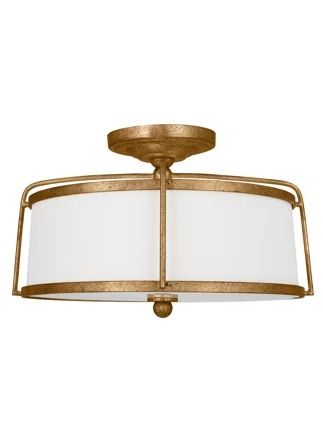 a light fixture with a white shade on it