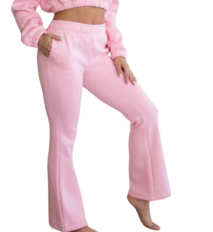 Stay cozy and stylish in our pink fleece flare sweatpants. Made with comfortable fleece material, these pants combine fashion and function. Perfect for lounging at home or running errands, these sweatpants will keep you warm and looking great. Flare Sweatpants, Pink Sweatpants, Pink Fleece, Stay Cozy, Running Errands, Looks Great, At Home, Sweatpants, Running